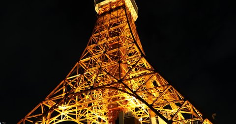 Tokyo, Japan - April 23, 2017: Spectacular perspective view of Tokyo Tower illuminated at night. The Tokyo Tower is a telecommunications building and also a panoramic observatory in Minato district