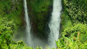 Tad Fane waterfall background (The Tad Fane twin falls thunder over 100 metres down the steep cliffs into a gorge, Bolaven plateau Paksong, Champasak, Laos, 16 May 2017) 1080p HD video, footage