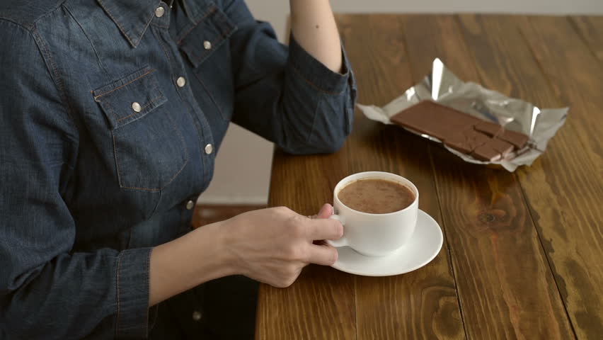 Unrecognizable woman drinking coffee