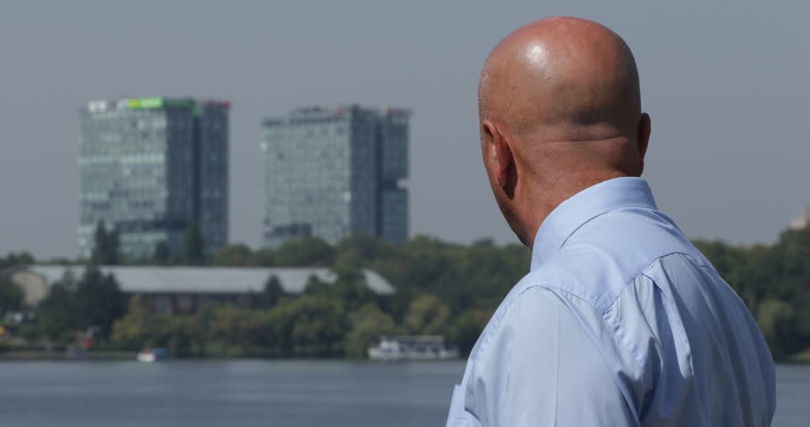 Company Businessman Outside Office Building Looking Around Waiting Partner ( Ultra High Definition, UltraHD, Ultra HD, UHD, 4K, 2160P, 4096x2160 )