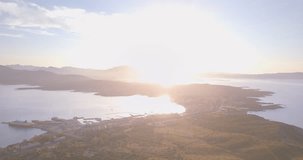Aerial video shot by a drone of a trekking to the top of the mountain at sunset. Emerald coast, Sardinia, Italy.