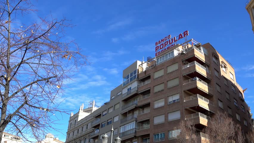 Street Recogidas in Granada. Granada is city in autonomous community of Andalusia, Spain, located at foot of Sierra Nevada mountains, on rivers Beiro, Darro, Genil and Monachil.