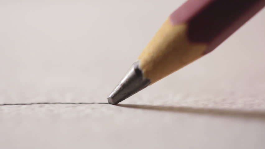 Artists hands drawing wooden pencil writes line on paper.