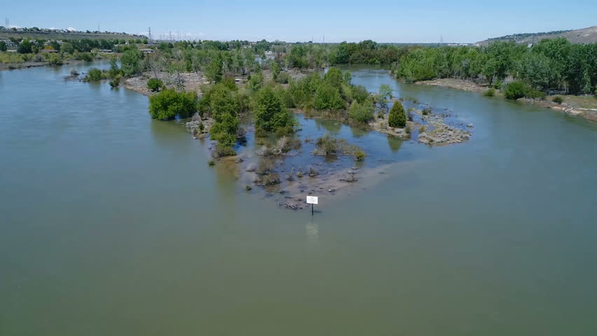 Boise River in Idaho at flood stage overtakes and island