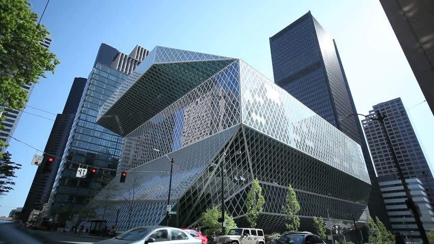 SEATTLE, USA - MAY 12: The Seattle Public Library and crossing with passing cars