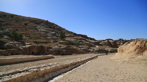 JORDAN, PETRA, DECEMBER 5, 2016: People in Petra, originally known to Nabataeans as Raqmu - historical and archaeological city in Hashemite Kingdom of Jordan