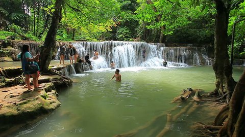 KANCHANABURI THAILAND - tourist playing huay mae kamin waterfall national park most popular traveling destination in kanchanaburi on august 30,2015 in kanchanaburi thailand