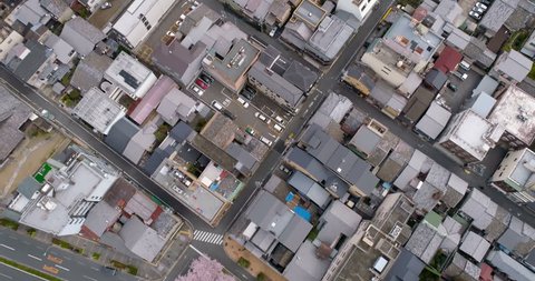 Aerial top view of Kyoto buildings with cherry blossoms trees, Japan