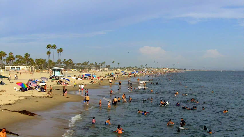 LONG BEACH, CA - AUGUST 5: A crowded beach on a hot summer day on August 5, 2012