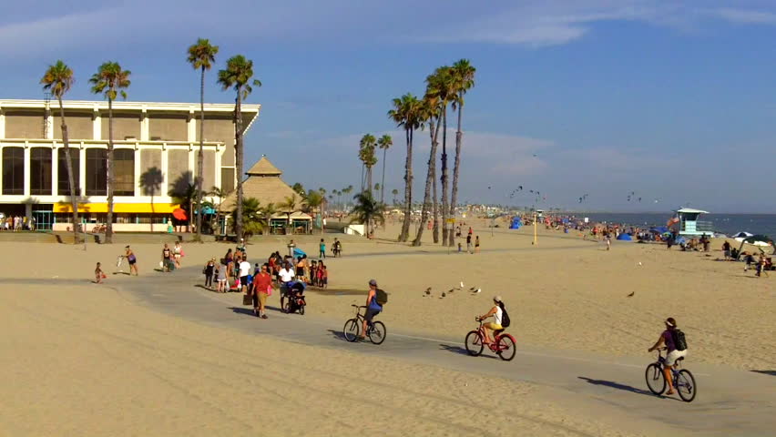 LONG BEACH, CA - AUGUST 5: Bike riders on the beach exercise pathway on August