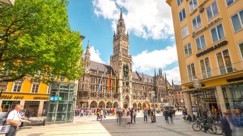 Munich, Germany - May 22, 2017: Moving Hyperlapse video in front of City Hall at Marienplatz square in 4K, Munich Bayern, Germany. Mary's public square Munich and New town hall in sunny day