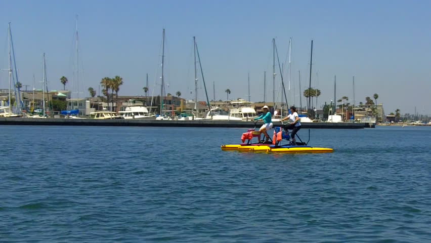 LONG BEACH, CA - AUGUST 5: Middle aged ladies paddle water bikes on August 5,