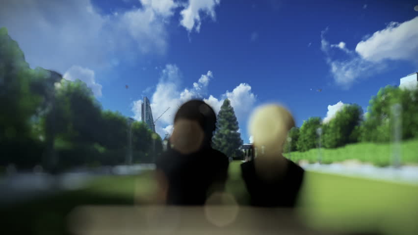 Beautiful couple seen through a glass orb, zoom out