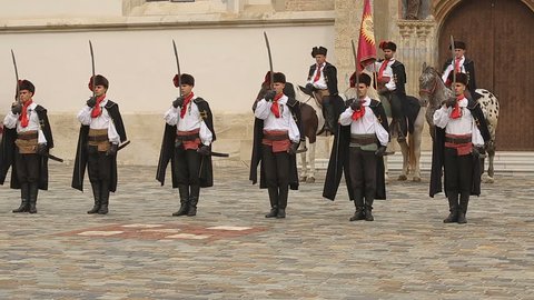 ZAGREB, CROATIA - CIRCA AUGUST 2014: Sightseeing in the city. Performance in Zagreb, Cravat Regiment standing in a line near St. Mark's church