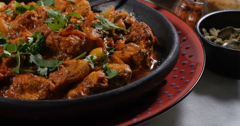 Dolly push in view of a delicious chicken tikka masala with Indian spices