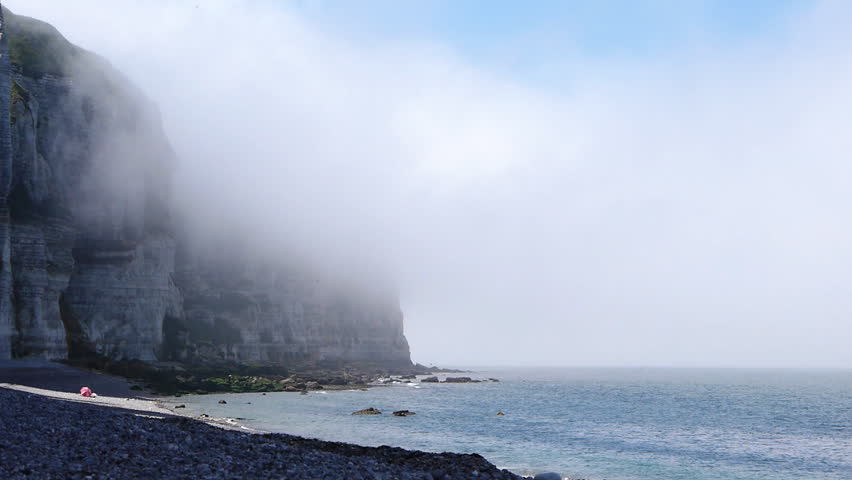 Cliffs near Etretat, France. A shot of the steep rocks with sea mist