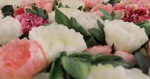 A lot of roses and Peonies stand in pots buckets, a Large Bouquet of Roses and Peonies, beautiful flower field yellow green white pink purple and red