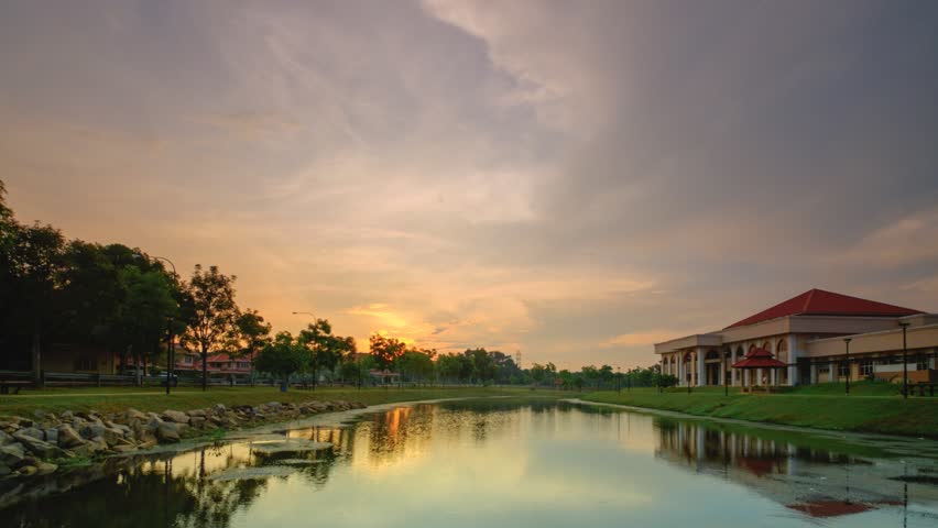 Time-lapse at lake of Pusat Islam,  Politeknik Muadzam Shah , Malaysia during sunset.