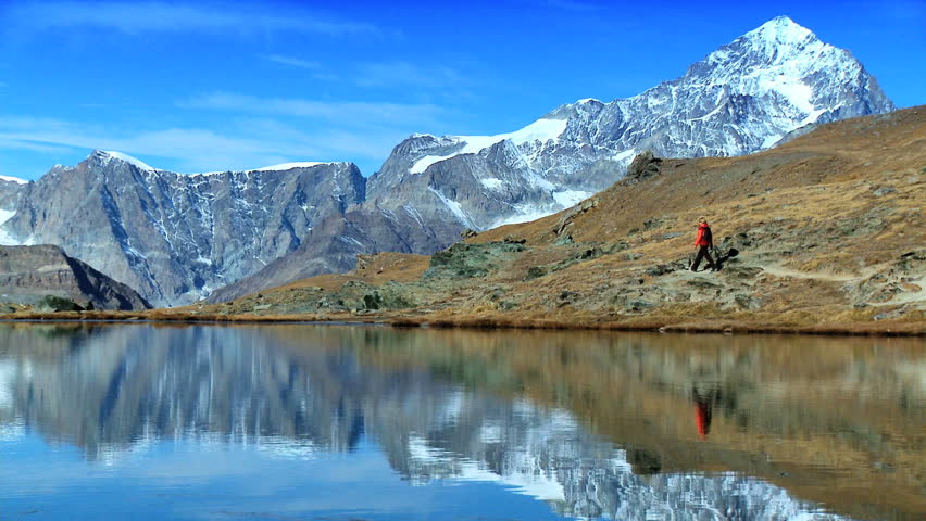 Hiker walking around Matterhorn Lake
