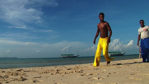 SALVADOR, BRAZIL - April 2008: Capoeira artist performs on the beach in Salvador, Bahia, Brazil