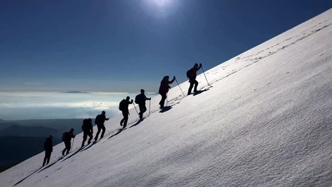 hiking group in snowy mountains
