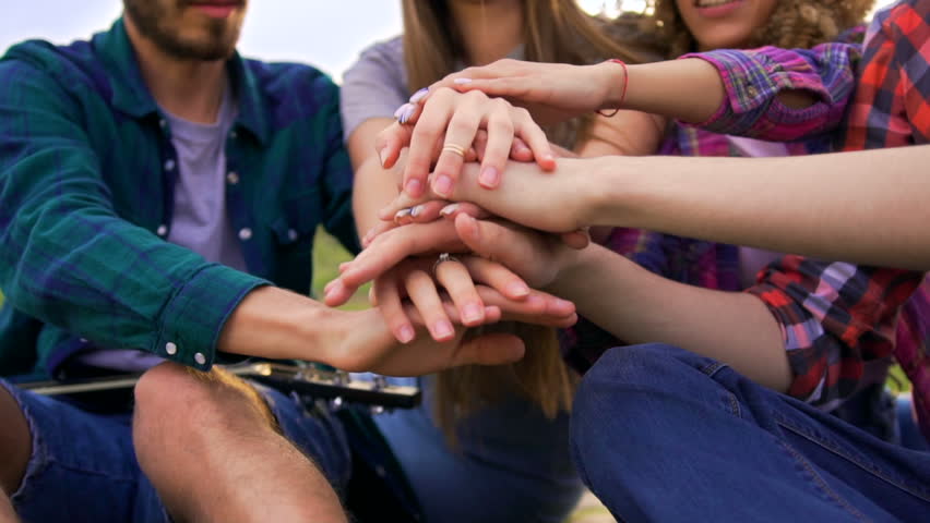 Friends put their hands together and throw them up. Team concept. Closeup shot Royalty-Free Stock Footage #27066220