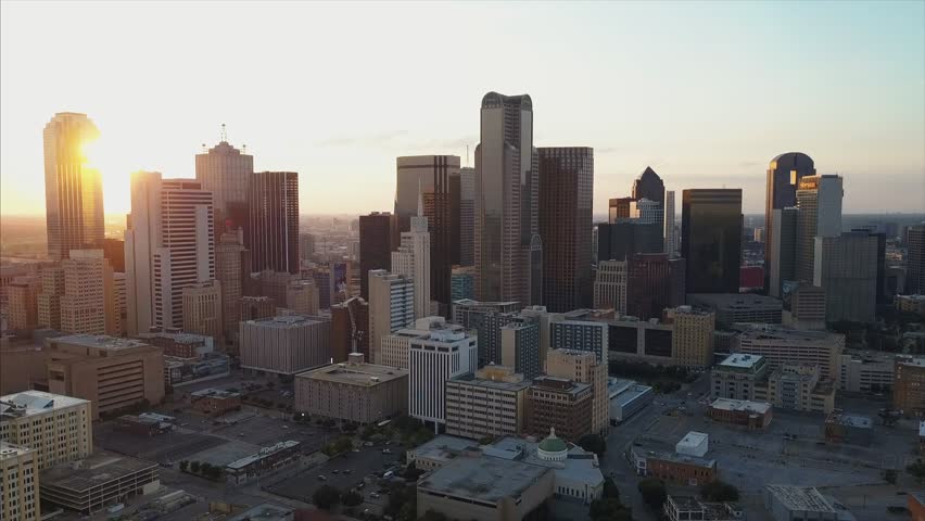 4K Aerial shot of Dallas downtown Skyline sunset pan move