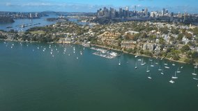 4k aerial hyperlapse video of Sydney Harbour, with view of Harbour Bridge,  and skyline of CBD