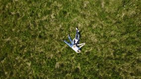 Aerial view of senior couple relaxing in grass