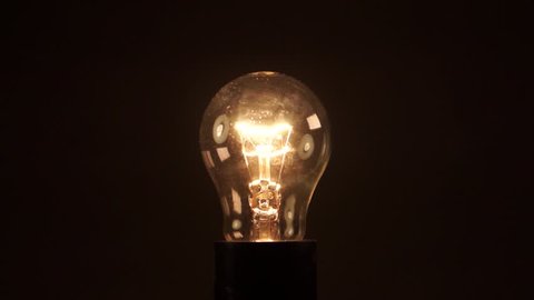 light bulb on black background Stock Footage Video (100% Royalty-free ...