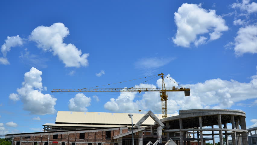 Time lapse clip of building over blue sky
