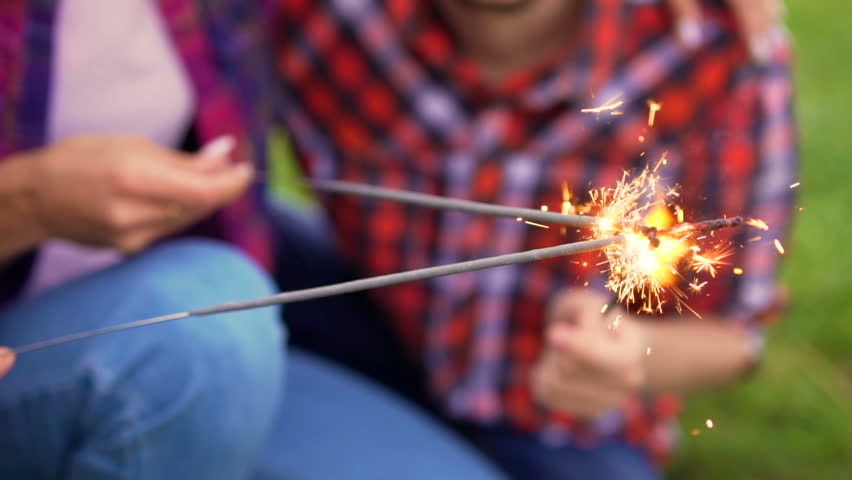 Portrait of four happy hipsters while they making selfie with sparklers on a smart phone. Cheerful people. Summer lifestyle Royalty-Free Stock Footage #27095464