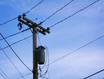 View of power lines hanging from a pole with silly electrical current animation DV NTSC video