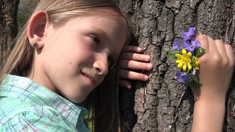 4K Happy Child Portrait Playing in Park, Girl Face with Spring Flowers in Nature