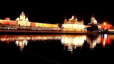 Golden Temple at night reflected on holy tank in Amritsar, India. Also known as The Harmandir Sahib