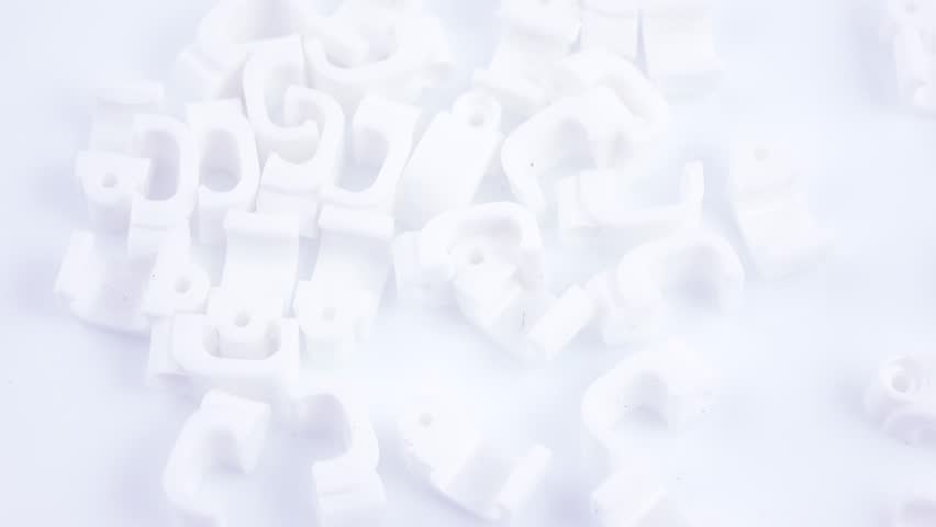 White plastic bracket for attaching wires