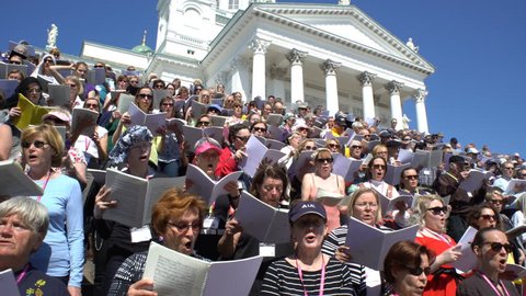 HELSINKI, FINLAND - MAY 19, 2017: Huge choir singing on the steps of the Cathedral. Rehearsal for the big choir at the Senate square on the eve of the church music festival Sana soi Stadissa .