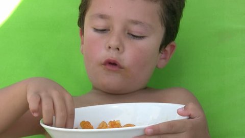 Little boy eating chips