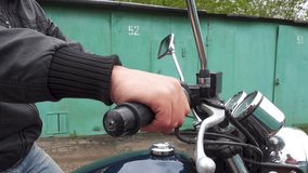 Motorcyclist turns the throttle stick
