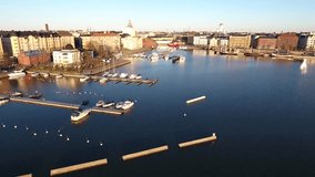 Aerial view drone 4K footage of Helsinki Baltic sea lagoon area Helsingfors district with boats, Finland, northern Europe