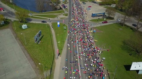 Aerial View of Lattelecom Marathon 2017, Runners run at the Riga International Marathon on May 14, 2017, Riga, Latvia, People run down the Streets between Daugava RIver and Park
