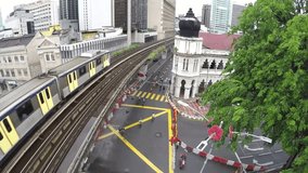 Kuala Lumpur - Malaysia - MERDEKA SQUARE: Moving Away From  LRT Train Track While Train Passes - Same Level