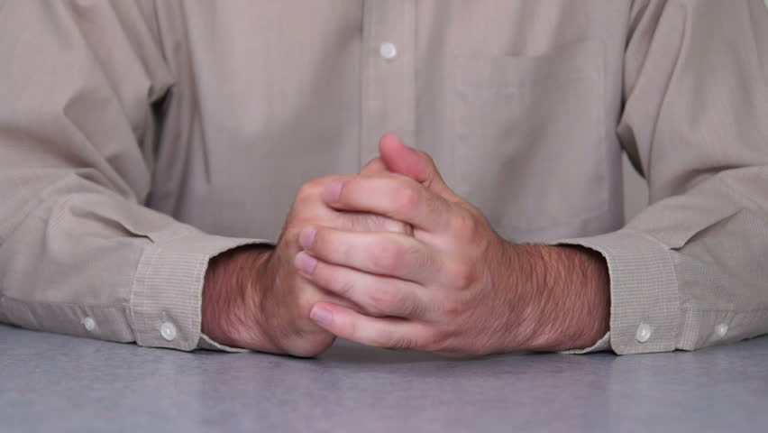 Male hands expressing fear and anxiety.