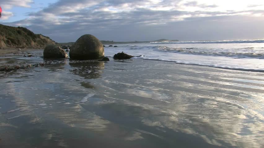 Moeraki, New Zealand. April 2012. The Moeraki Boulders are a group of large spherical “stones” or concretions that have been exposed through shoreline erosion on Koekohe Beach near Moeraki