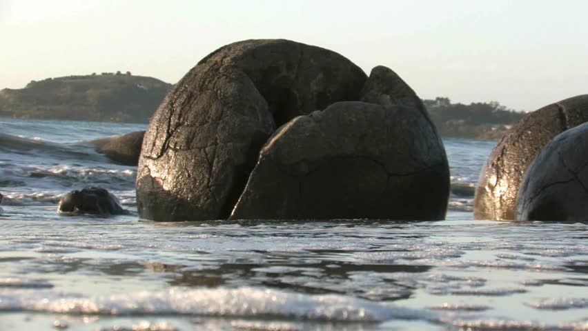 Moeraki, New Zealand. April 2012. The Moeraki Boulders are a group of large spherical “stones” or concretions that have been exposed through shoreline erosion on Koekohe Beach near Moeraki