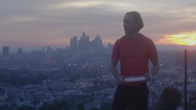 Man Tosses Frisbee At Sunset Skyline Los Angeles_2 - Powered by Shutterstock - Get 15% off with code: PIKWIZARD15