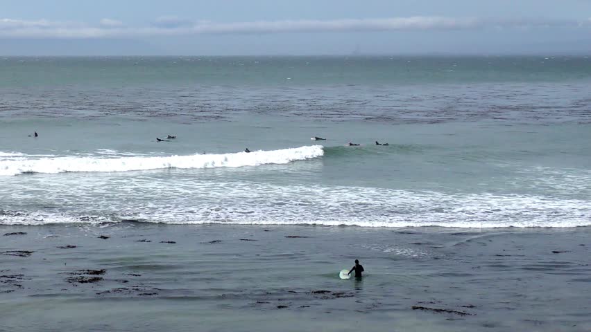 Unidentified surfers at the Pleasure Point in Santa Cruz, on the northern Monterey Bay in Santa Cruz County, California, USA, a world renowned surf location