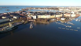 Aerial view drone 4K footage of Helsinki Baltic sea lagoon area Kruununhaka district with boats, Finland, northern Europe