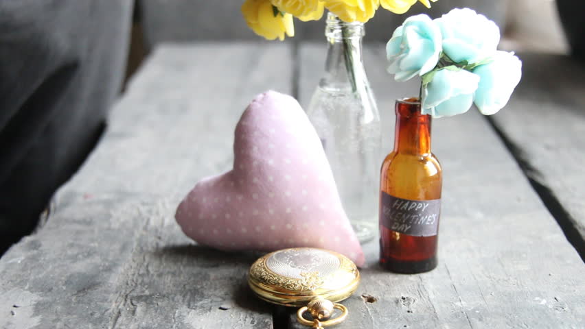 Happy Valentines Day label and nice flowers in the bottles
