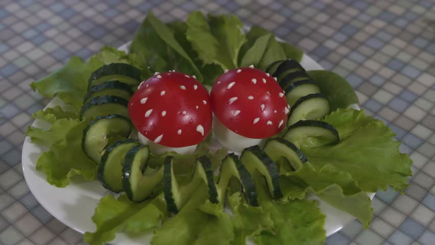 Close-Up of Hands of a Young Girl With Painted Nails Are Placed in a Dish of Salad With Improvised Mushrooms From Eggs and Tomatoes,a Bunch of Parsley Leaves